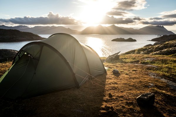 How to plan a camping trip that includes visits to UK wildlife reserves?
